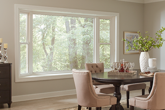 bay and bow window in a nice cream colored home